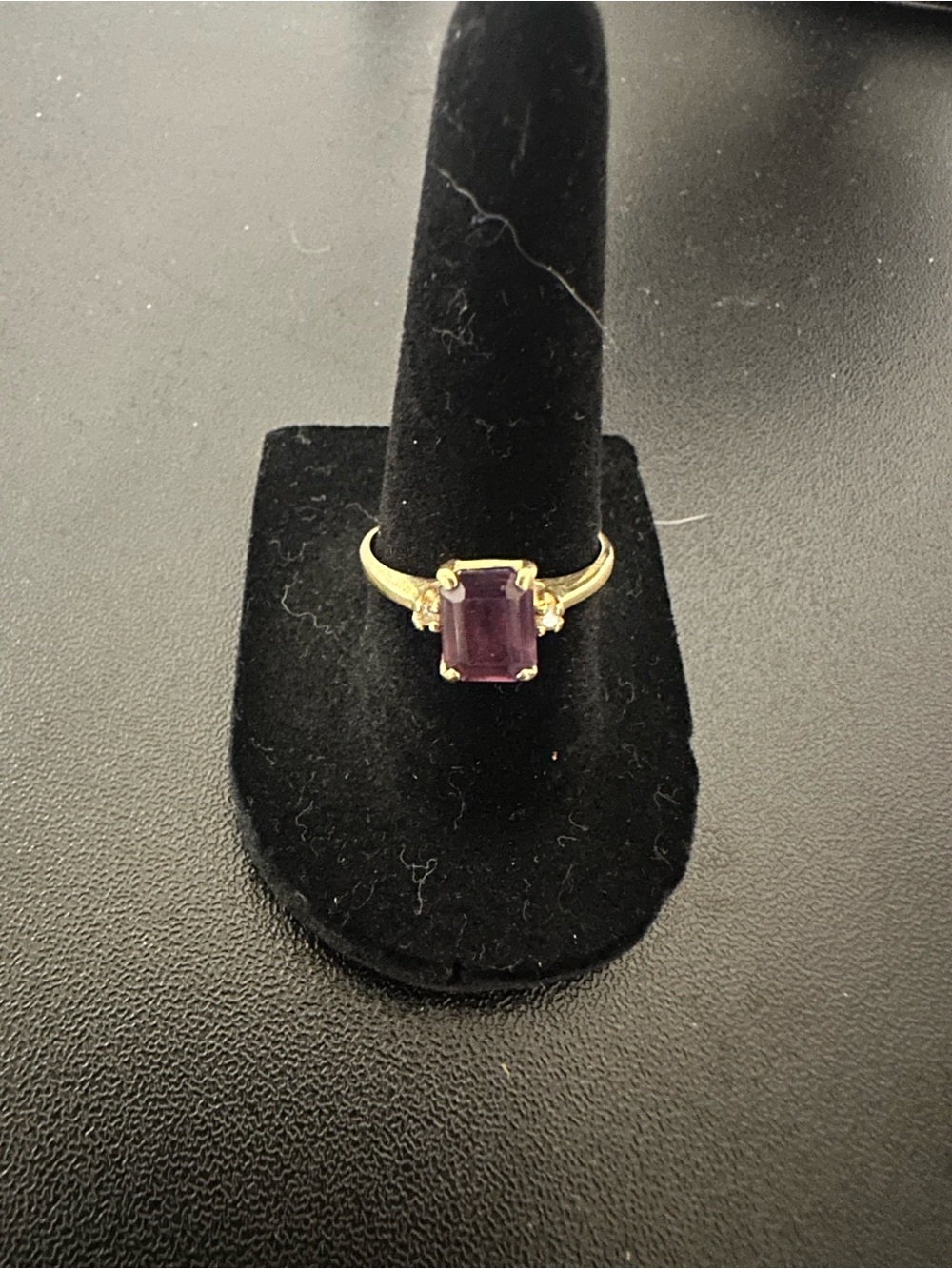 Gold Ring with Purple Center Stone and Accent Gems